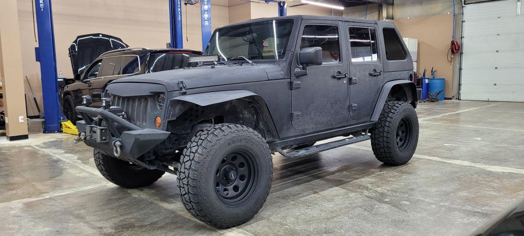 Thumbnail image of 2009 Jeep Wrangler Unlimited at MIDWEST MOTORS